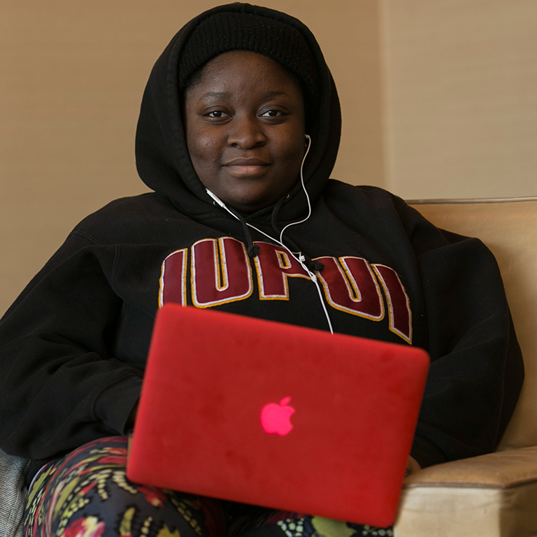 A student working on her laptop.